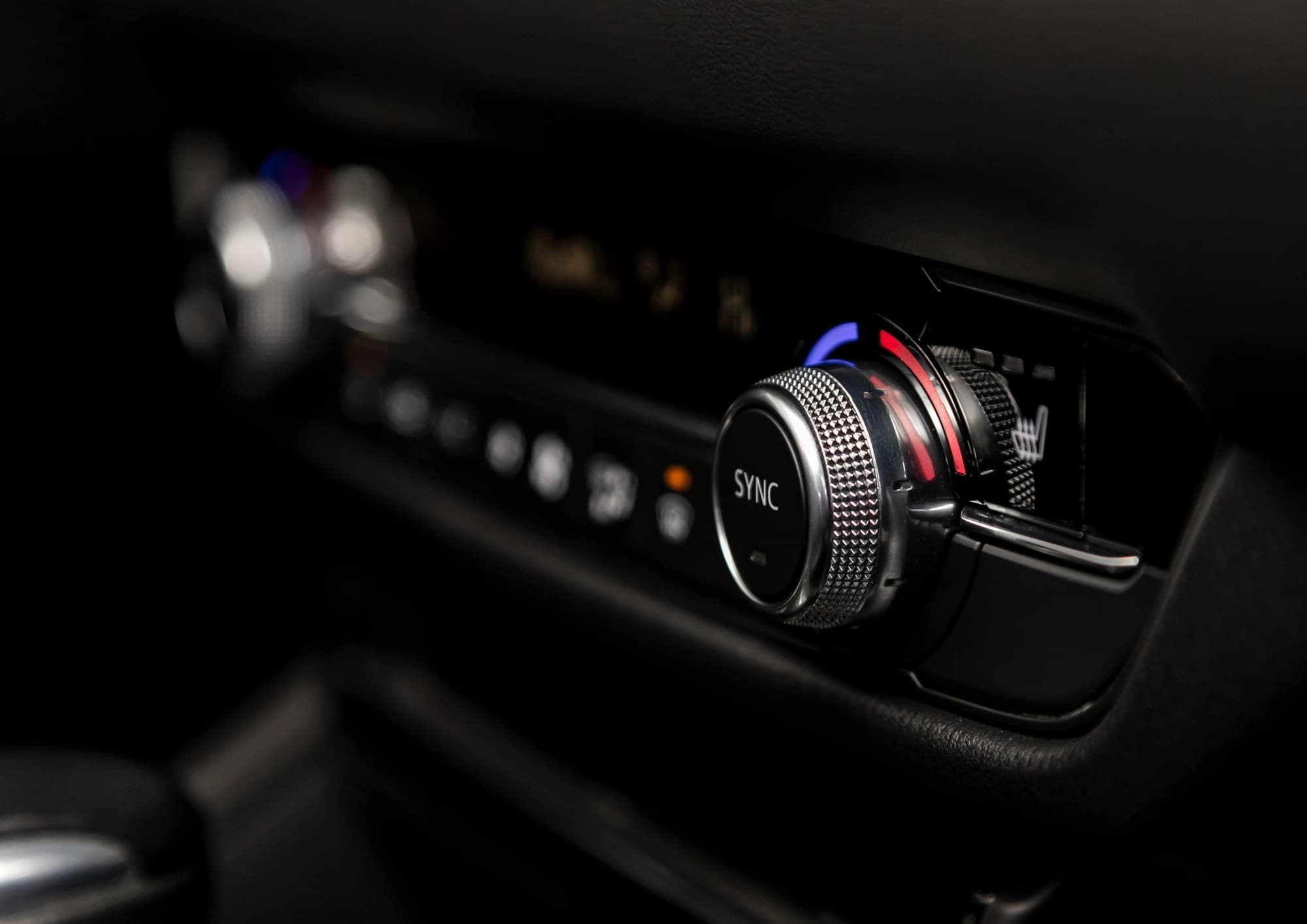 Macro shot of a car dashboard control dial